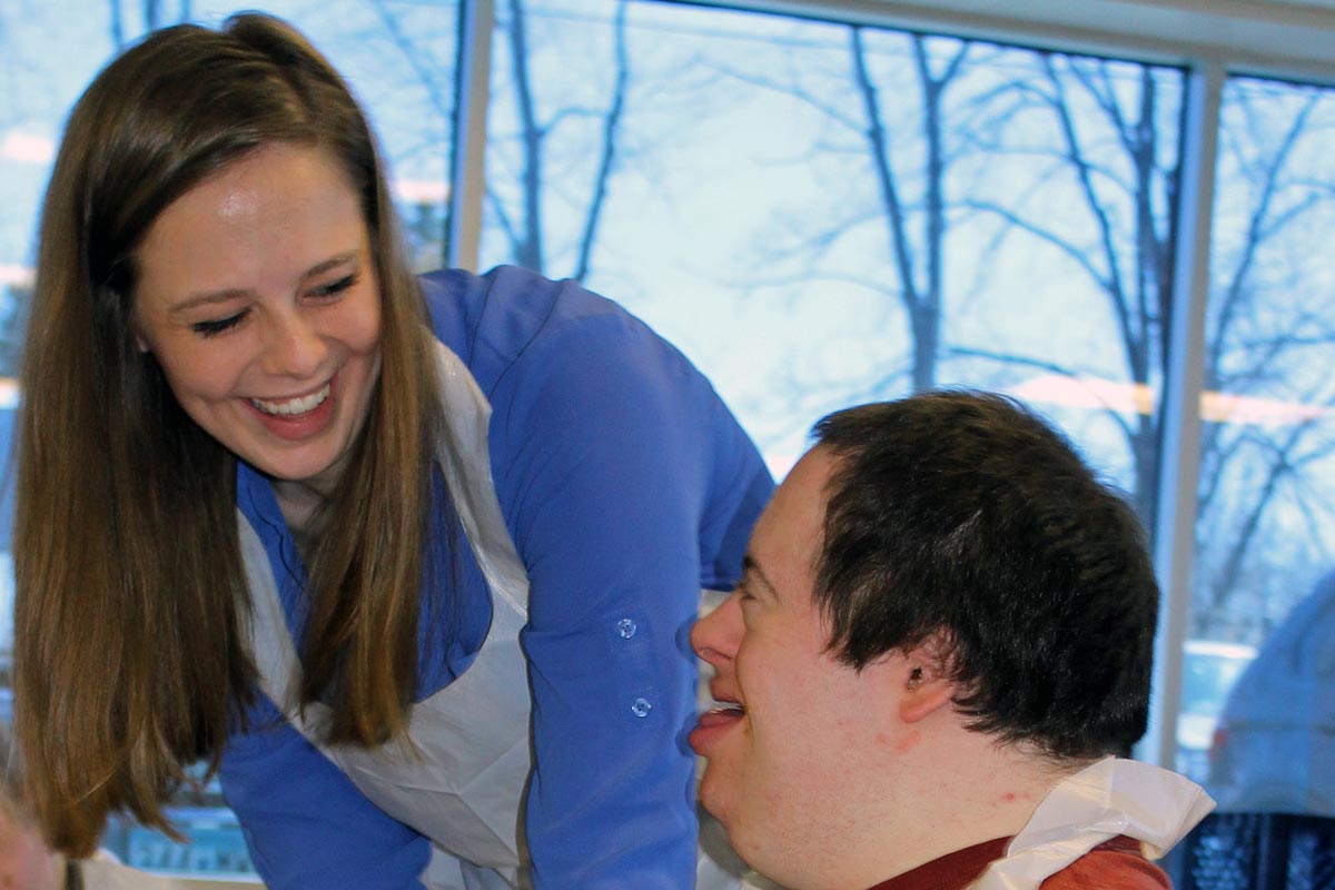 careers helping people with disabilities twin cities girl helping boy smiling